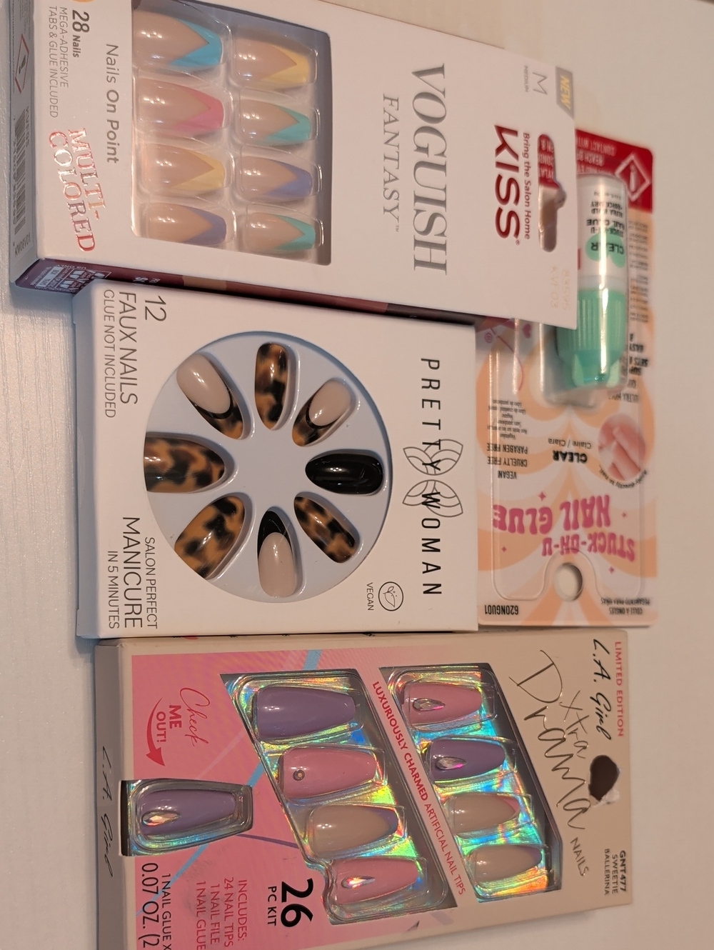 KISS Multi-Pack Women’s Faux Nails Set in Pastel Pink, Lavender, Nude & Black